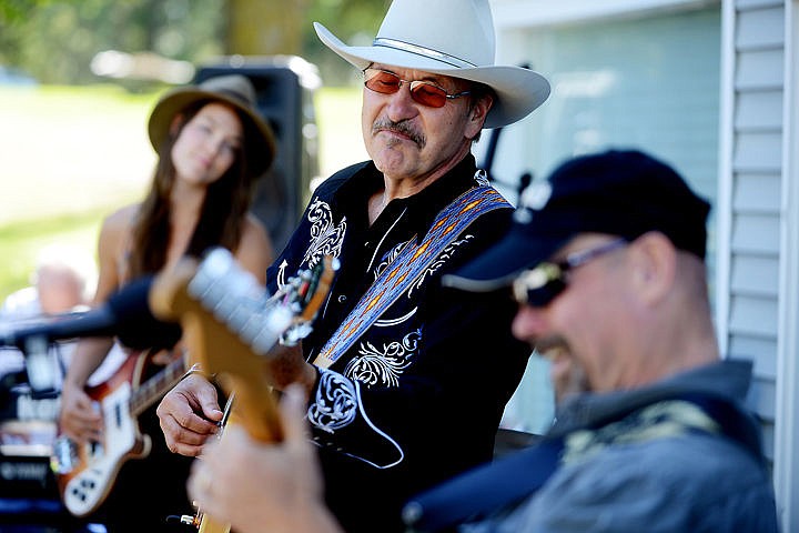 &lt;p&gt;Rob Quist plays a song with Craig Davey, right, and his daughter Halladay Quist, at the Memorial Sendoff for Mark Wittman on Sunday, September 7. (Brenda Ahearn/Daily Inter Lake)&lt;/p&gt;