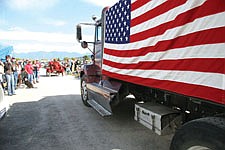 A Chief Cliff Fire Department truck adorned in the red, white and blue wades through the parade route during Saturday's annual Dayton Daze. The event coincided with the ninth anniversary of the Sept. 11 terrorist attacks.