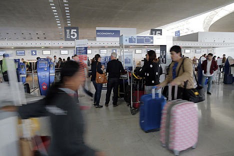 &lt;p&gt;Travelers walk past Air France desk at Paris Charles de Gaulle airport, in Roissy, near Paris, Monday. Pilots for Air France have kicked off a weeklong strike, angry that the airline is shifting jobs and operations to a low-cost carrier to better keep up with competition.&#160;&lt;/p&gt;