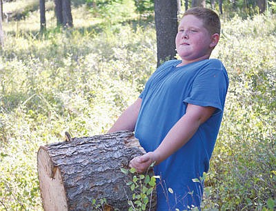 &lt;p&gt;Worth the weight: Lucas Graves hauls a heavy load from the nearby wooded area to the Libby Elementary schoolyard. Graves was one of nearly 300 kids who spent an hour of their Friday afternoon collecting wood to be auctioned off for students Kiye Jenkins and Katherine Lind, both diagnosed this year with stage four Hodgkins Lymphoma. (Seaborn Larson/The Western News)&lt;/p&gt;
