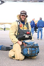 Smoke jumper Evan Karp exhibits his uniform, stuffed with the gear he would carry when battling a blaze.