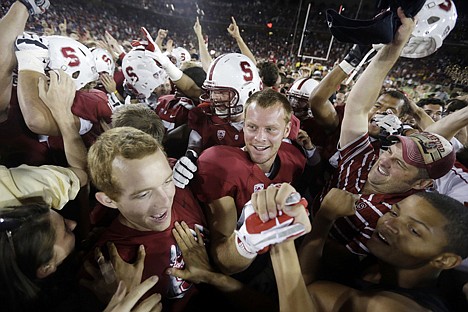 &lt;p&gt;Stanford players and fans celebrate a 21-14 win over Southern California on Saturday night at Stanford, Calif.&lt;/p&gt;