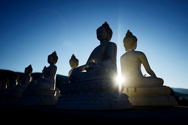 &lt;p&gt;The rising sun is framed between two statues of the Buddha on Tuesday, September 10, at the Ewam Garden of One Thousand Buddhas in Arlee, Mont. There will be two fundraising events in the Flathead this week featuring the band, Naked Soul. The benefit concerts will begin at 7 p.m. at The Raven in Bigfork tonight, and again at 7 p.m. at the Great Northern Brewery in Whitefish on Thursday. There will also be a free community presentation at noon in the board room inside Blake Hall at Flathead Valley Community College at noon which will include Buddhist devotional singing and chanting. (Brenda Ahearn/Daily Inter Lake)&lt;/p&gt;