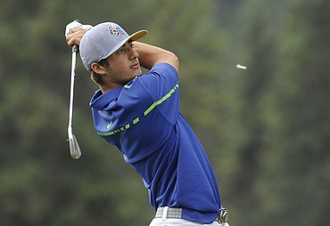 <p>Glacier's Cody Scherrill tees off on the 14th hole during the Kalispell Invitational at the Buffalo Hills Golf Course on Thursday. (Aaric Bryan/Daily Inter Lake)</p>