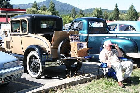 Jason Shueh/Valley Press Dennis Miller, sits behind his 1929 Model A Ford Coup.