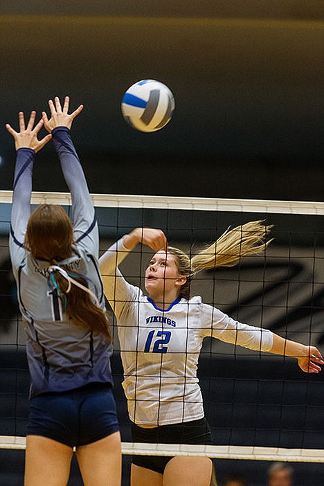 &lt;p&gt;Coeur d&#146;Alene&#146;s Sydney Bybee tips the ball over the net in the second set against Lake City.&lt;/p&gt;