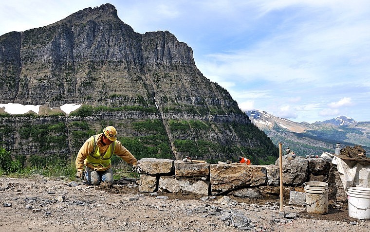 Mike Bercier with Anderson Masonry works on a rock wall along Going-to-the Sun Road between Big Bend and Logan Pass in Glacier National Park in mid-August. Because of intensive reconstruction work on that stretch of road, western access to Logan Pass will be closed to vehicles at midnight tonight. Road gates will be set up at  Avalanche Campground as Sun Road work shifts to a higher gear. Park visitors still will be able to drive to Logan Pass from the east side.