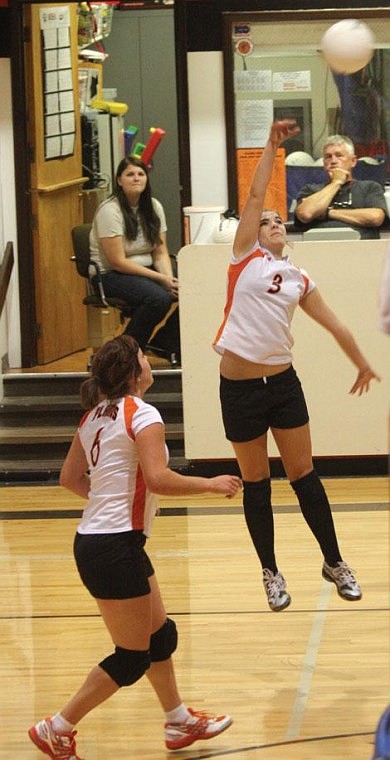 Jennifer McBride/Valley Press Junior Lacey Hermiston leaps to return a bal back to Thompson Falls.