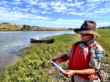 &lt;p&gt;Connie Jacobs, director of the Missouri Breaks Interpretive Center, reads information about an EarthCache on the Missouri River near Fort Benton, Mont., Aug. 28.&#160;&lt;/p&gt;