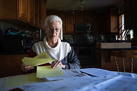 &lt;p&gt;Wuest&#146;s neighbor, Carlyn Dickerson, sorts through paperwork she has collected as she investigates what she believes has been Wuest&#146;s abuse of power.&lt;/p&gt;