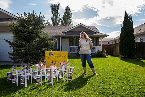 &lt;p&gt;Jennifer McNulty stands next to the 22 crosses she placed in her yard to bring awareness to soldier suicide in honor of her husband, Wyatt McNulty, who committed suicide in 2012 after 11 years as a Sergeant in the United States Army.&lt;/p&gt;