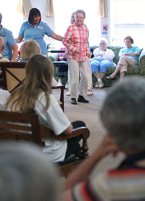 &lt;p&gt;Kelly Jo Barnwell, left, director of the Anderson County Senior Citizens Program, helps resident Elizabeth McClure dance with Anderson County Outreach Players during their visit to Summit Place in Anderson, S.C., July 14. Barnwell, who pours full-time enthusiasm into a part-time job, gets frequent reminders in the form of hugs.&lt;/p&gt;