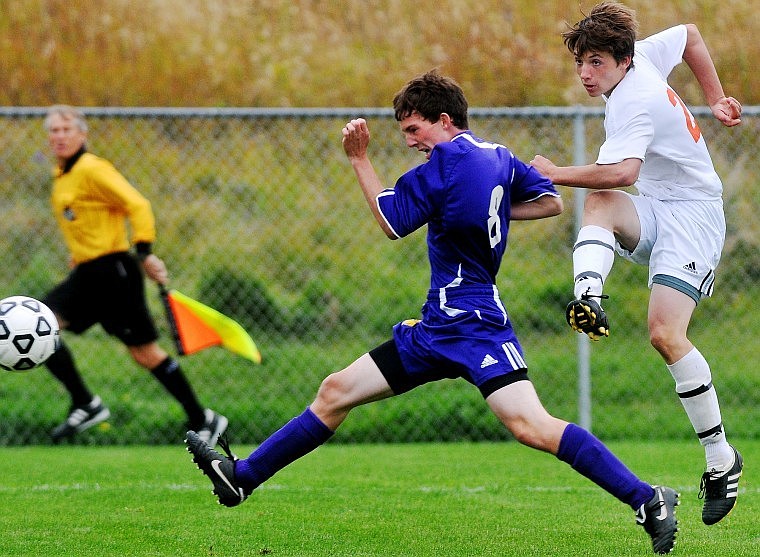 Flathead's Monte White fires a shot past Missoula Sentinel's Dayton Kohler.