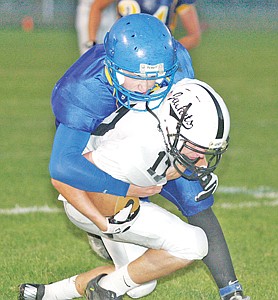 &lt;p&gt;Bryce Gustin tackling Chris Lords in second quarter.&lt;/p&gt;