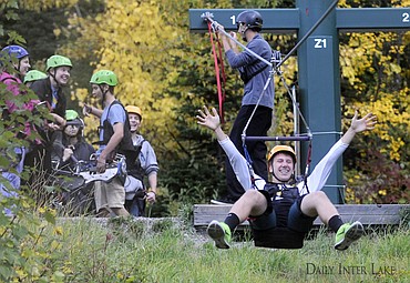 <p>Keaton Grove goes down the zip line as the rest of the physics class watches at Whitefish Mountain Resort Friday. The Whitefish physics class collected data to use the rest of the year as they learn about velocity, friction, time, distance and other physics topics. (Aaric Bryan/Daily Inter Lake)</p>