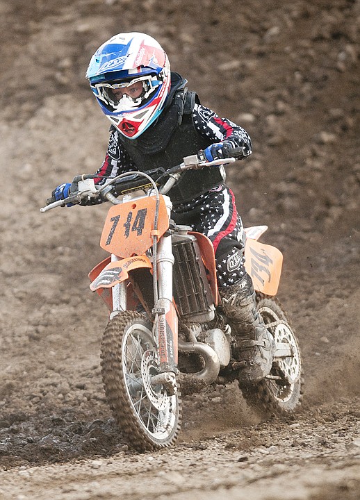 <p>Ty Allen practices his riding on a dirt track west of Kalispell
on Thursday evening.</p>