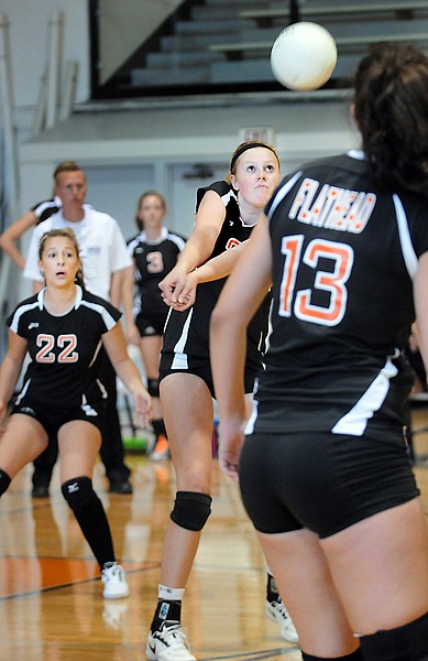 <p>Flathead senior Hannah Sackett (center) returns a serve during
the first set of Saturdays Western AA home volleyball match with
Helena High.</p>