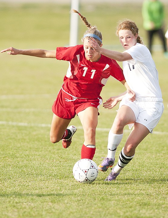 <p>Glaciers Chantal Gustine fights for position with Missoula
Hellgate's DeNae Vandam (11) during Glacier's loss to Missoula
Hellgate at home on Thursday evening.</p>