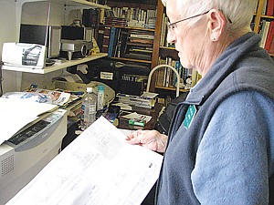 Pat Witham, of the Grant County Historical Museum, holds a diagram of a potato exhibit the museum recently acquired.