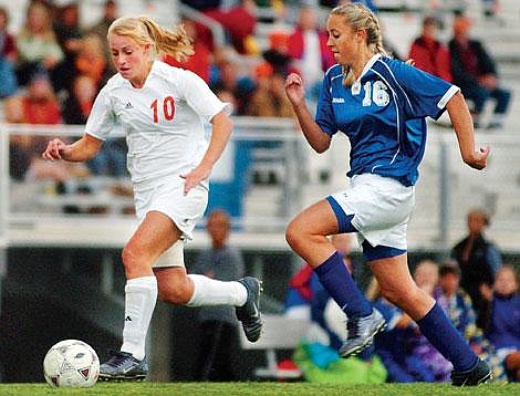 Flathead's Heidi Windauer breaks away from Columbia Falls' Samantha Thompson for one of her two goals during Flatheads 6-1 victory Tuesday at Legends Stadium in Kalispell. Chris Jordan/Daily Inter Lake