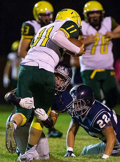&lt;p&gt;Lake City&#146;s Half Back Jerry Louie McGee tackles Shadle Park&#146;s quarterback Brett Rypien in the third quarter of the game Friday night.&lt;/p&gt;