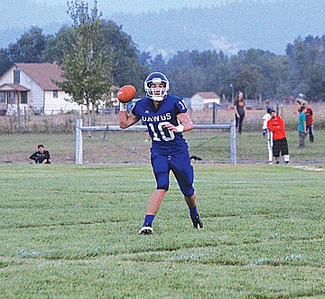 &lt;p class=&quot;p1&quot;&gt;&lt;span class=&quot;s1&quot;&gt;Bulldogs quarterback Dylan Evans looks down field for a target on Friday. In addition for three touchdowns, Evans ran for a score.&lt;/span&gt;&lt;/p&gt;