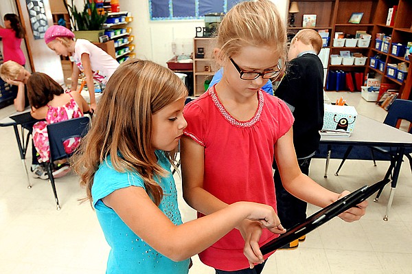 &lt;p&gt;From left, Deanna Mann, and Noelle Abernathy use an iPad to work on a project on Thursday, September 6, at Helena Flats School.&lt;/p&gt;