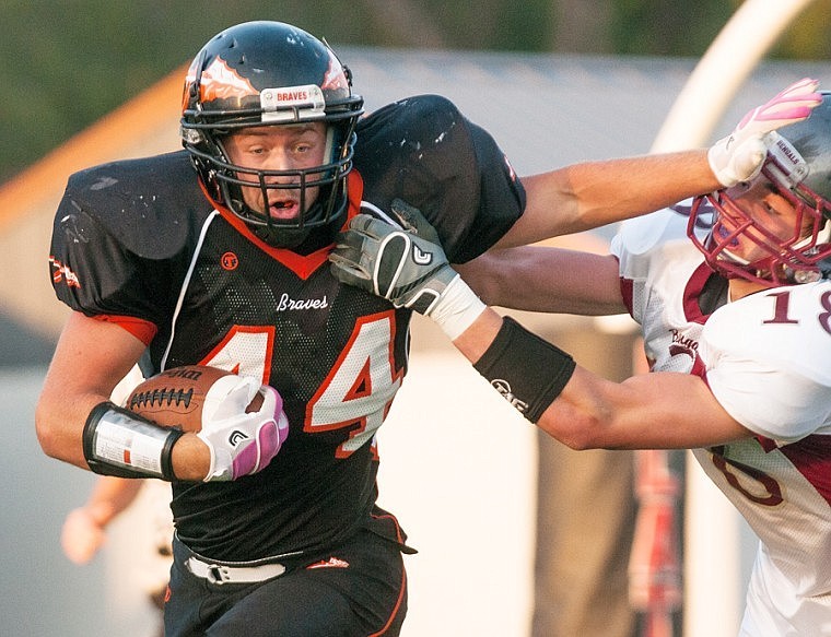 &lt;p&gt;Flathead Braves&#146; running back Austin Root (44) stiff-arms Helena High defender McRide Galt (18) during Friday night&#146;s homecoming game at Legends Stadium.&lt;/p&gt;&lt;p&gt;&lt;/p&gt;