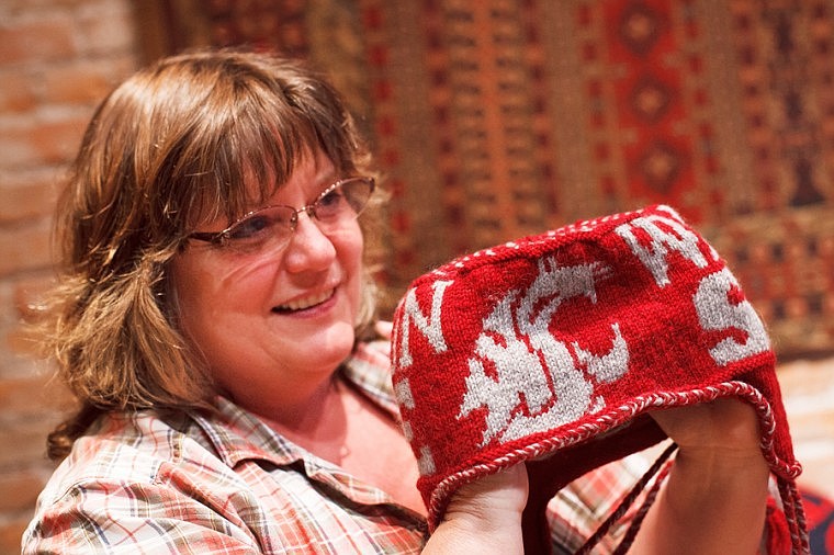 &lt;p&gt;Melanie Cross, owner of Camas Creek Yarn, shows off a Washington State University-themed ski hat Monday afternoon at Camas Creek Yarn. Cross has developed patterns that will allow knitters to create their own university-themed hats and scarves.&lt;/p&gt;