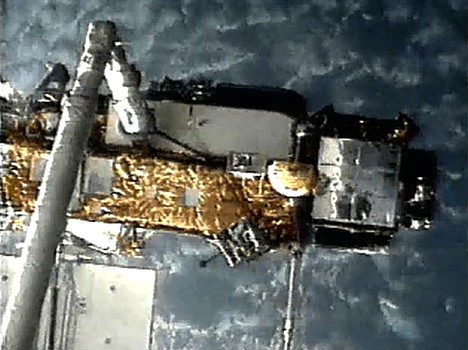 &lt;p&gt;This screen grab image provided by NASA shows UARS attached to the robotic arm of the space shuttle Discovery during mission STS-48 in 1991, when UARS was deployed. NASA scientists are doing their best to tell us where a plummeting 6-ton satellite will fall later this week. It's just that if they're off a little bit, it could mean the difference between hitting Florida or New York. Or, say, Iran or India. (AP Photo/NASA)&lt;/p&gt;