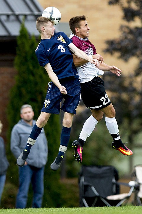 <p>JAKE PARRISH/Press North Idaho forward Alec Maldonado (22) narrowly misses a header as he goes up against Ian Shirey (3) of Spokane on Wednesday at North Idaho College.</p>