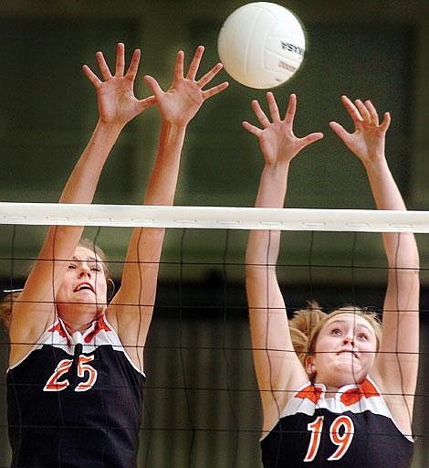 Flathead's Chelsea Vaudt, left, and Brianna Fenner combine for a block during the first game of Flathead's 3-1 victory over Missoula Big Sky Tuesday night in Kalispell. Chris Jordan/Daily Inter Lake