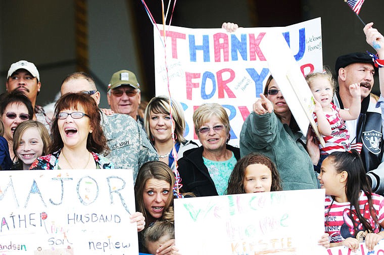 &lt;p&gt;Friends and family react to seeing the plane Saturday afternoon during the return of the 495th Combat Sustainment Support Battalion.&lt;/p&gt;