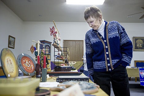 &lt;p&gt;Randi Ludwig of Spokane looks over traditional Norwegian hand-painted crafts made by Hayden artist Ginny Brown on Saturday at the Norwegian Heritage Fair in the Independent Order of Odd Fellows Lodge in Post Falls.&lt;/p&gt;