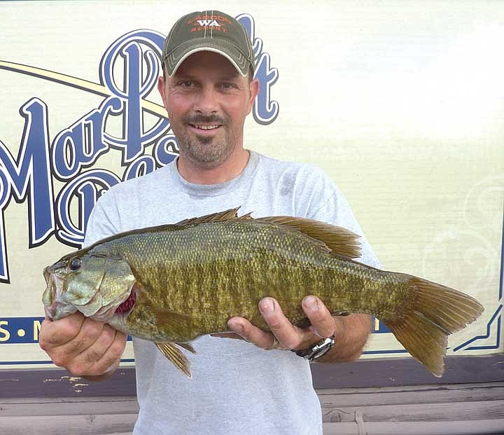 Nat Barber, of Monroe, shows a nice 4.8lb smallmouth bass he caught off Goose Island.