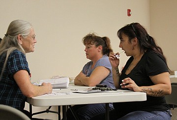 Volunteer Jeana Moore takes swabs from potential donors