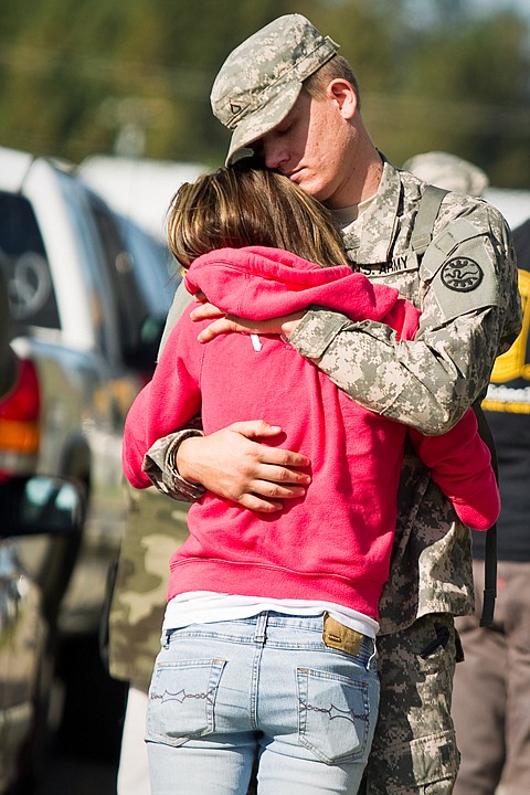 &lt;p&gt;Dallas Ausmus, Pfc., Army National Guard, embraces fiance Whitney Randolph prior to leaving Post Falls for two months of training in Mississippi before a 10-month tour of duty in Iraq.&lt;/p&gt;