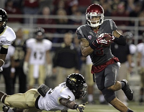 &lt;p&gt;Washington State wide receiver Gabe Marks (9) eludes the tackle attempt by Idaho safety D'Mario Carter (3) as he scores a touchdown during the first quarter Saturday in Pullman.&lt;/p&gt;