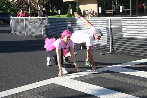 &lt;p&gt;Hanna Dobler, left, and her husband, Michael, have fun stretching at the starting line of Sunday's Race for the Cure, a fundraising event to raise awareness and find a cure for breast cancer.&lt;/p&gt;