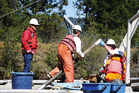 &lt;p&gt;Workers for Dixon Marine seal a plastic tube containing a sediment core sample from the bed of the lower Coeur d'Alene River on Friday. The U.S. Environmental Protection Agency is seeking to determine where along the Coeur d'Alene River that heavy metals polluted sediments are most likely to be picked up and eventually washed into Lake Coeur d'Alene.&lt;/p&gt;