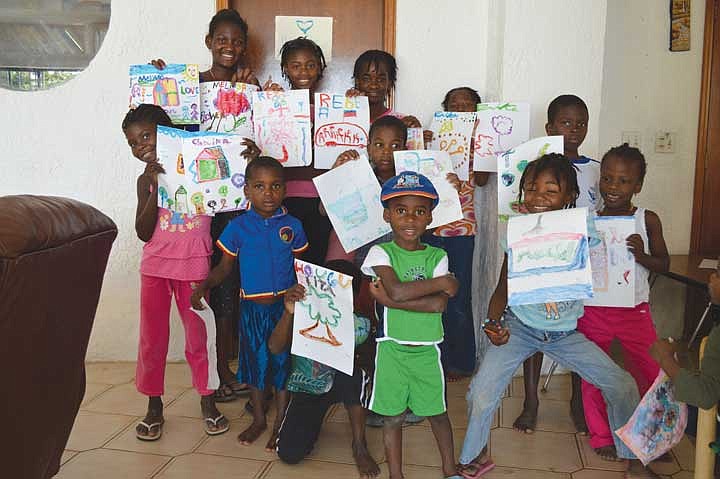 The youngsters at the Haitian orphanage that received the donation from the Royal Slope show their gratitude with smiles and hand-crafted messages.&#160;