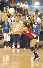 Mission senior libero Mackenzie Trudeau gets one of her digs against Plains last Thursday night.