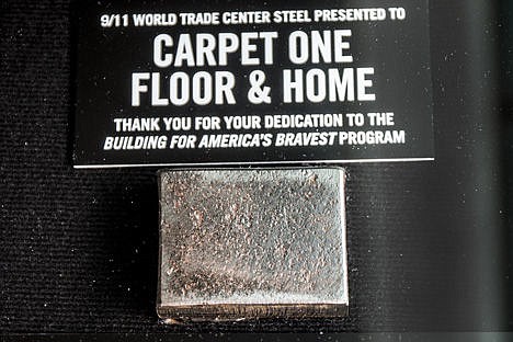 &lt;p&gt;A piece of steel from one of the World Trade Center towers that fell on Sept. 11, 2001 is pictured in a glass box Tuesday. The remnent was donated to Panhandle Carpet One in Coeur d'Alene from the Stephen Siller Tunnel to Towers Foundation due to Carpet One's contribution to the foundation's effort to build smart homes for wounded soldiers.&lt;/p&gt;