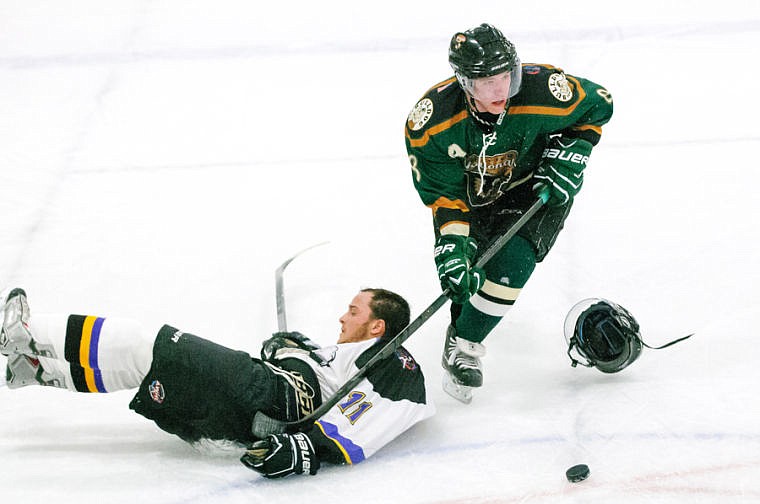 &lt;p&gt;Glacier's Chris Cutshall (8) looks to shoot after colliding with a Wild defender Thursday night during the Nationals' home loss to Gillette at the Stumptown Ice Den in Whitefish. Sept. 19, 2013 in Whitefish, Montana. (Patrick Cote/Daily Inter Lake)&lt;/p&gt;