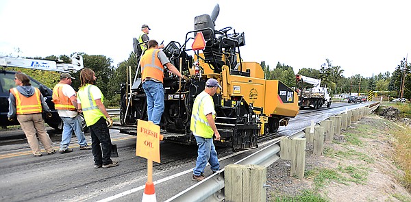 &lt;p&gt;Flathead County workers repave Whitefish Stage Road over the Stillwater River on Tuesday afternoon.&lt;/p&gt;