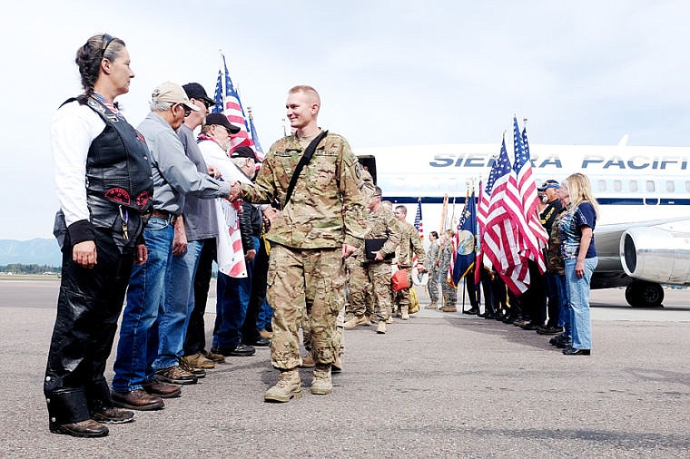 &lt;p&gt;Patriot Guard Riders welcome home soldiers in the 495th Combat Sustainment Support Battalion as they exit their plane Saturday afternoon at the Glacier Jet Center at Glacier Park International Airport. (Patrick Cote photos/Daily Inter Lake)&lt;/p&gt;