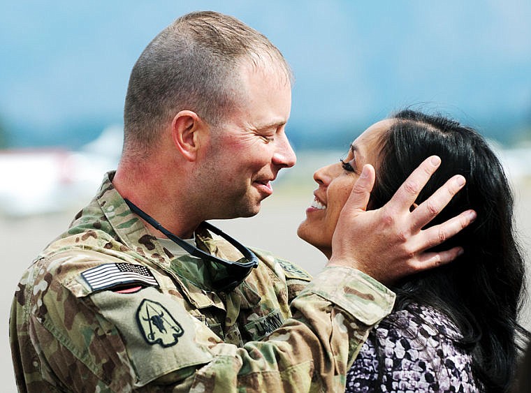 &lt;p&gt;Major Chase Ragen embraces his wife Daniela Saturday afternoon during the return of the 495th Combat Sustainment Support Battalion.&lt;/p&gt;