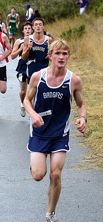 Alec Perkins in front with Nathan Grow following closely behind run at the Farragut Cross Country meet Saturday.