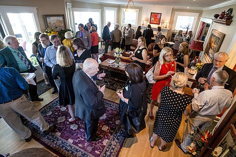 &lt;p&gt;More than 50 people socialize at the private reception for the Idaho Humanities Council's 12th Annual Northern Idaho Distinguished Humanities Lecture and Dinner, featuring Pulitzer-Prize winning journalist and novelist Diane McWhorter, on Tuesday in the home of Denny Davis and Kathy Canfield-Davis.&lt;/p&gt;