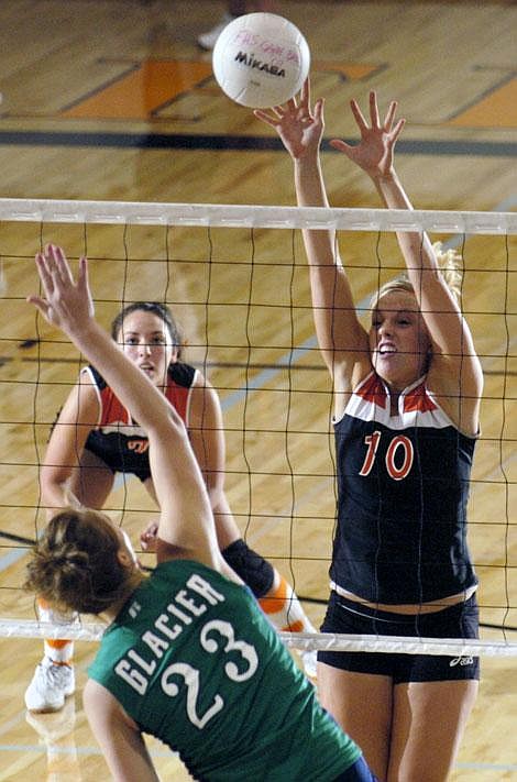 Flathead&#146;s Shaina Evans (10) goes up to block a shot by Glacier&#146;s Emilee Hashley (23) while Laurie Swindall looks on during Saturday&#146;s game at Flathead High School in Kalispell. Jennifer DeMonte/Daily Inter Lake